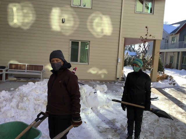 Hi, ho, hi, ho. Fran and Kim are off to dig some snow.